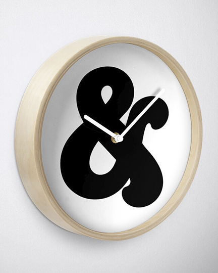 clock with ampersand design on face, framed with bamboo wood